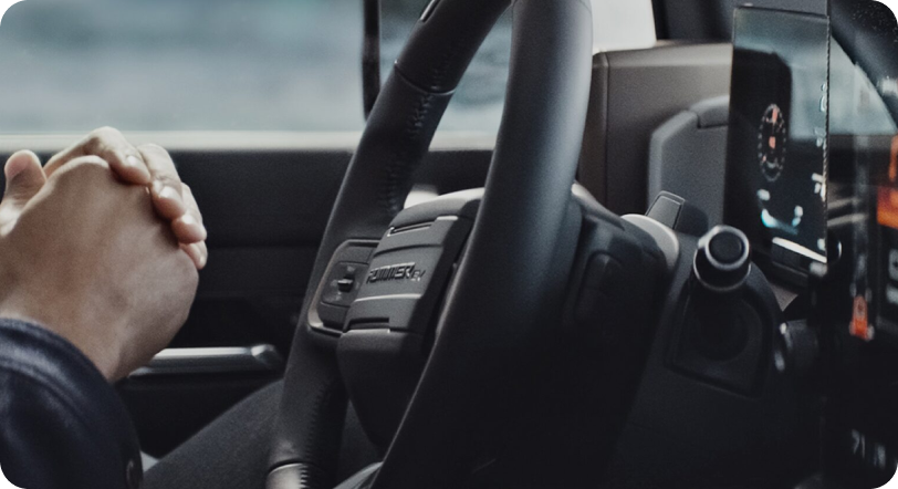 A man in a GM EV ready to take it out for a ride for the first time