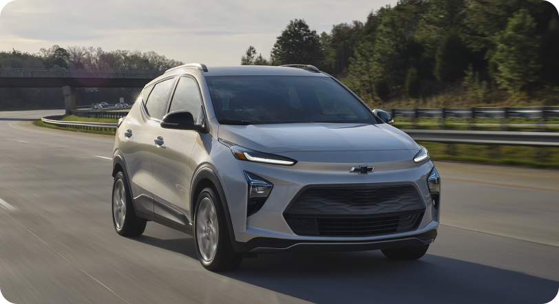 Chevrolet Bolt EV driving on road.