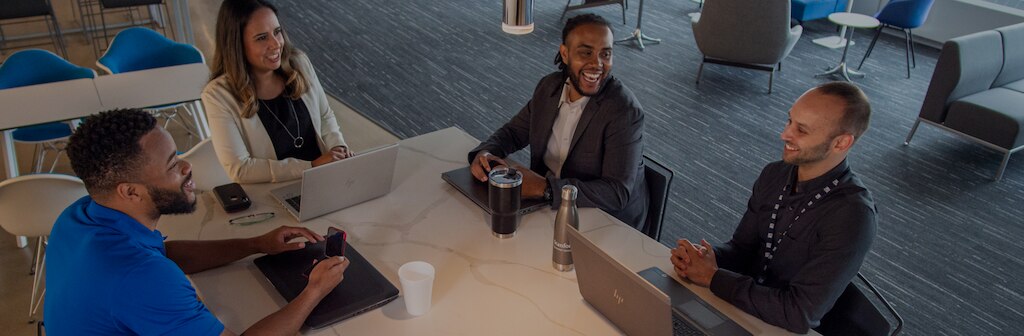 coworkers talking at a table