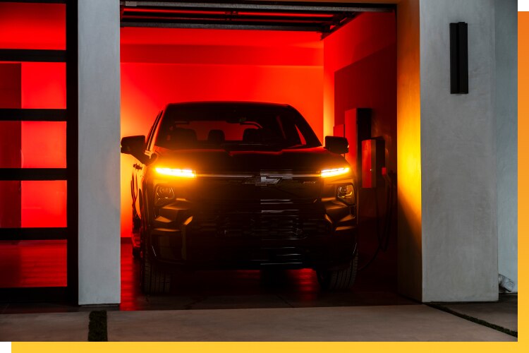 Black Chevy EV parked in Garage